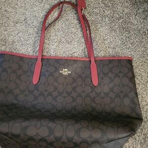 Brown and red Coach purse